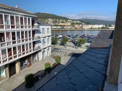 an aerial view of a city with a parking lot at Apartamento en el centro de Viveiro in Vivero