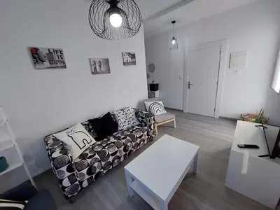 a living room with a couch and a table at Acea Nova 1 in Monforte de Lemos