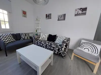 a living room with a couch and a table at Acea Nova 1 in Monforte de Lemos