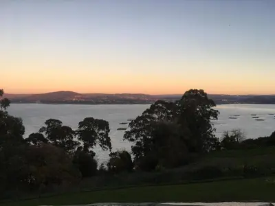 a view of a large body of water at sunset at CASA FONTE DA PEDREIRA in Sada