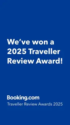 a blue sign that says weve won a traveler review award at Apartamento Piscina 1G by Urraca Suites Viveiro in Viveiro