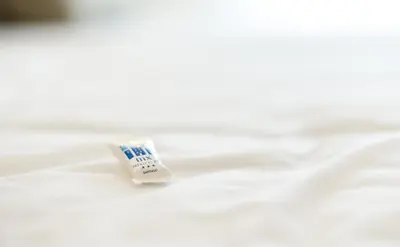 a tube of toothpaste sitting on top of a white table at México PR in Santiago de Compostela