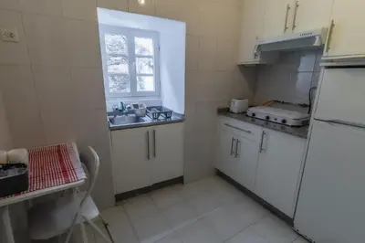 a bathroom with a toilet and a shower and a sink at Hostal San Pelayo in Santiago de Compostela