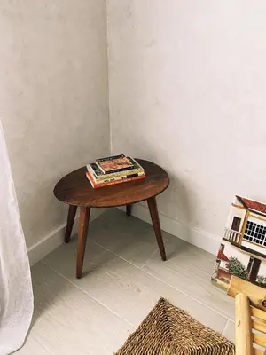 a wooden table in a corner with a book on it at Casa Amodiño in Belesar
