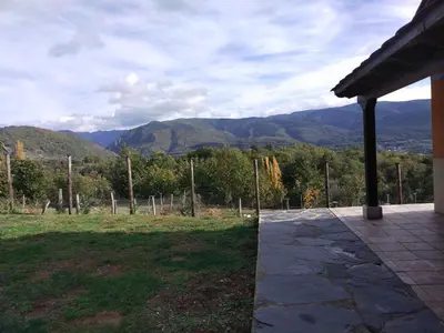 a patio with a view of the mountains at Casa Antonio in Susañe del Sil