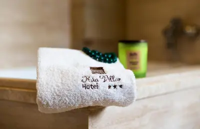a towel sitting on a counter in a bathroom at Hotel Rua Villar in Santiago de Compostela