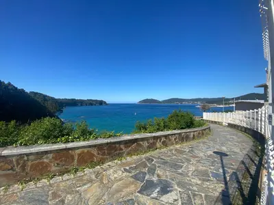 a view of a body of water with a fence at Apartamentos Las Sirenas in Viveiro