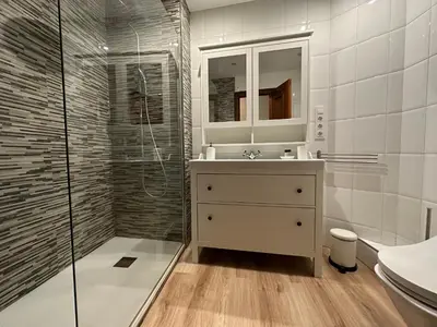 a white bathroom with a sink and a shower at Casa Da Ponte By Oktheway in Puentedeume