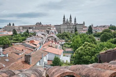 a view of a city with buildings and roofs at Hotel Pombal Rooms in Santiago de Compostela