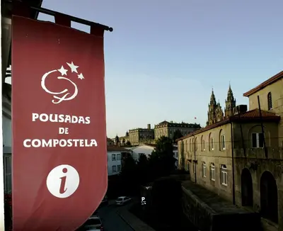 a sign for the town of pologias de comunicacion at San Clemente by Pousadas de Compostela in Santiago de Compostela