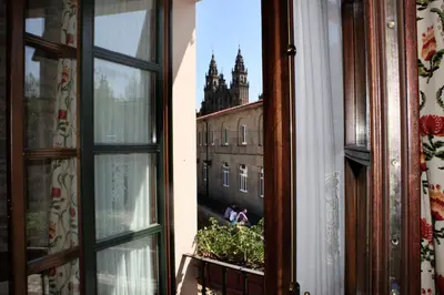 an open window with a view of a building at San Clemente by Pousadas de Compostela in Santiago de Compostela