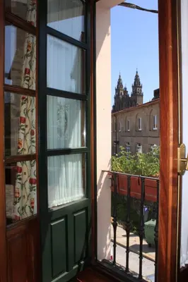 an open door to a balcony with a view of a building at San Clemente by Pousadas de Compostela in Santiago de Compostela