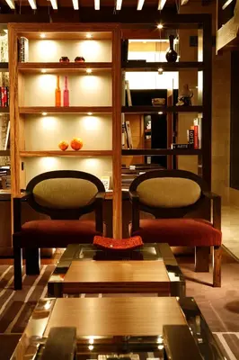 a living room with two chairs and a table at Hotel Altaïr in Santiago de Compostela