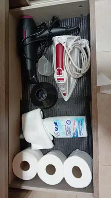 a drawer filled with toilet paper and other items at A parada da Ribeira in Ourense
