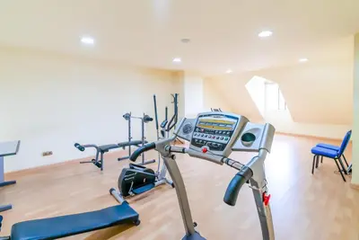 a gym with three exercise bikes in a room at Ponferrada Plaza in Ponferrada