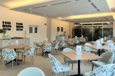 a table topped with plates of breakfast foods and drinks at Aparthotel Attica21 As Galeras in Bastiagueiro