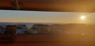 a view of the sunset from a balcony of a city at Piedad Fernandez Fernandez Gestion de Inmuebles - II in Burela de Cabo