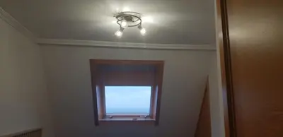 a ceiling light and a window in a room at Piedad Fernandez Fernandez Gestion de Inmuebles - II in Burela de Cabo