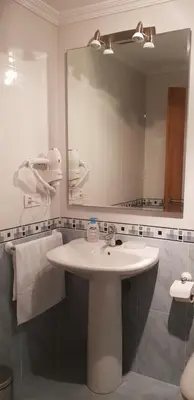 a bathroom with a sink and a large mirror at Piedad Fernandez Fernandez Gestion de Inmuebles - II in Burela de Cabo