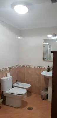 a bathroom with a toilet and a sink at Piedad Fernandez Fernandez Gestion de Inmuebles - II in Burela de Cabo