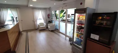 a room with a refrigerator with drinks in it at Hotel Parking Miradoiro de Belvís in Santiago de Compostela