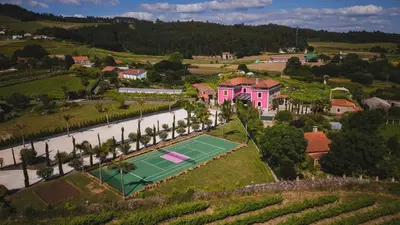 an aerial view of a house with a tennis court at Casa Beatnik Country House in Santiago de Compostela