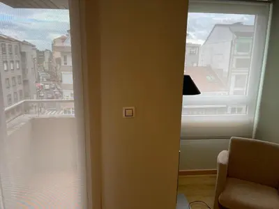 a room with a window with a view of a city at Aparthotel Arenteiro in Carballino