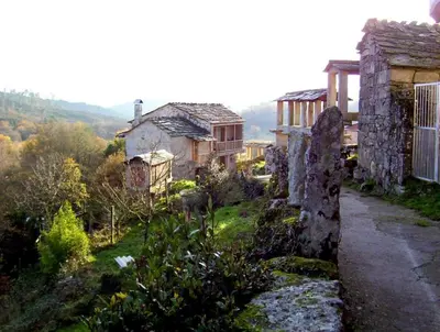 an old house on the side of a hill at Casa da Laxa in Beáriz