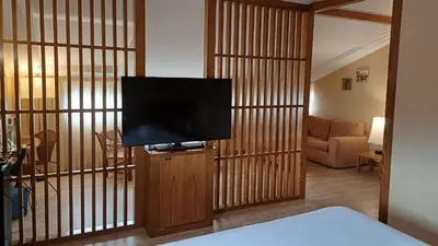 a living room with a flat screen tv in a room at Ruta Jacobea in Lavacolla