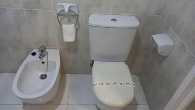 a bathroom with a toilet and a bidet at Motel Montecarlo in Teo