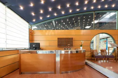 an office with a counter with a computer on it at Exe Area Central in Santiago de Compostela