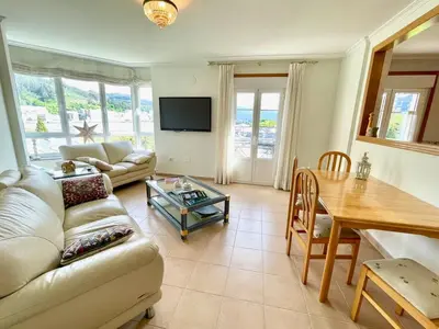 a living room with a couch and a table at The Cliffs - Passion Eccehomo in Viveiro