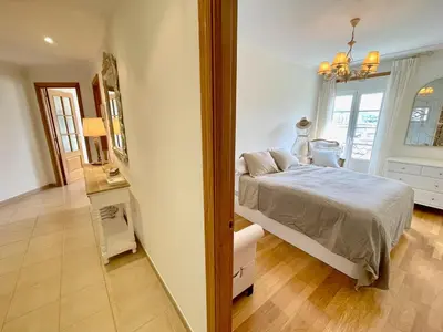a bedroom with a bed and a table and a mirror at The Cliffs - Passion Eccehomo in Viveiro