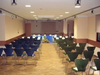 a large room with chairs and tables in it at Hotel Francisco II in Ourense