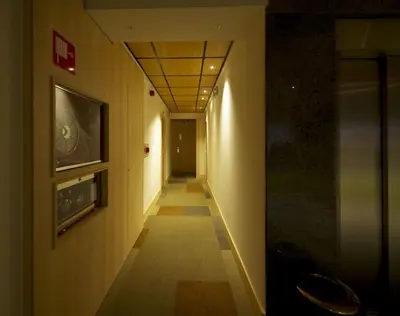a hallway with a tile floor and a ceiling at Hotel Francisco II in Ourense