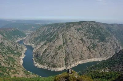 an aerial view of a mountain with a lake at A Casa da Eira in Cerreda