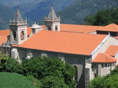 an old building with an orange tile roof at A Casa da Eira in Cerreda