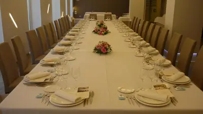 a long table with wine glasses and napkins on it at Hotel Mendez Nuñez in Lugo