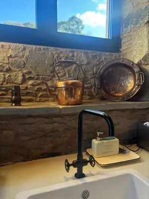 a kitchen sink with a toaster on top of it at Lar do Gado in Porta