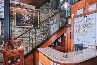 a staircase in a restaurant with a stair case at Hotel Entrecercas in Santiago de Compostela
