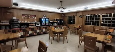 a dining room with tables and chairs in a restaurant at Hotel A Marisqueira I Aeropuerto A Coruña in Oleiros