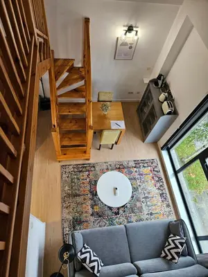 an overhead view of a living room with a couch and stairs at Apartamentos Ciudad Santiago in Santiago de Compostela