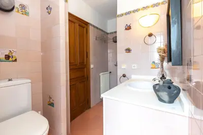 a bathroom with a sink and a toilet at Casa Grande de Cornide Santiago de Compostela in Teo