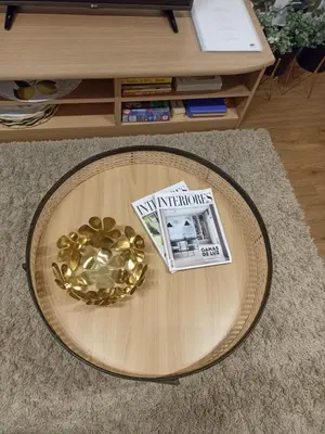 a table with a gold bowl and a newspaper on it at EL ATICO in Caldas de Reis
