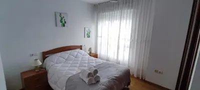 a bedroom with a bed with a stuffed animal on it at MIRADOR DEL EO in Ribadeo