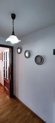 a room with three lights on a white wall at MIRADOR DEL EO in Ribadeo