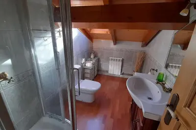 a bathroom with a shower and a toilet and a sink at Casa da Pilar - A Ponte in Portomourisco