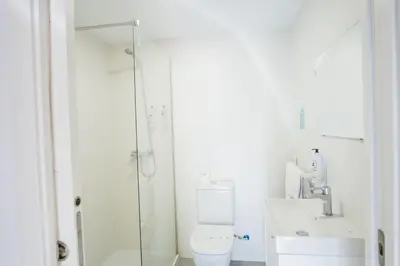 a bathroom with a shower and a toilet and a sink at Alda Cabanas Nature in Cabañas