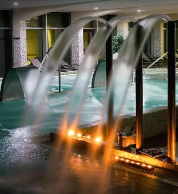 a fountain in the middle of a water park at IBERIK Augas Santas Balneario & Golf in Pantón
