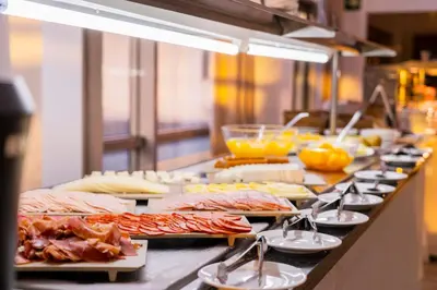 a buffet line with many different types of food at IBERIK Augas Santas Balneario & Golf in Pantón